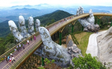 The hands supporting the gold bridge, to keep the sky in Da Nang – Vietnam